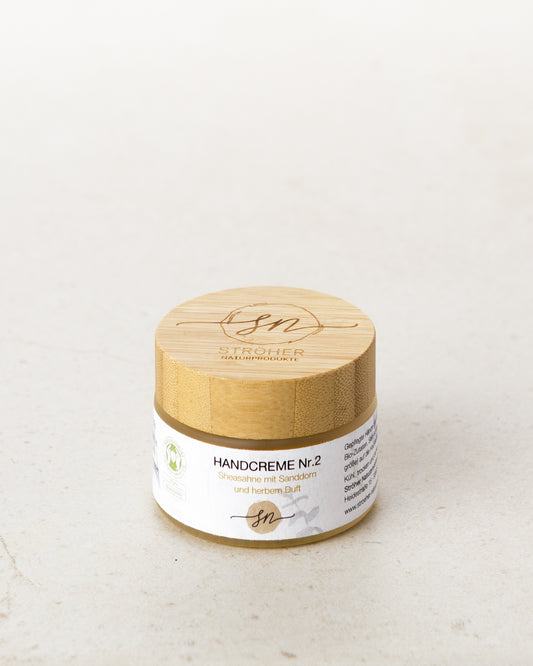 Natürliche Handcreme Nr. 2 – Sheasahne mit Sanddorn und herbem Duft ohne Deko in wiederverwendbarem Glasgefäß- Zutaten im Text beschrieben