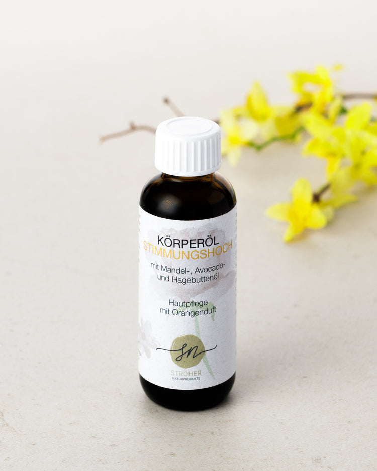 Natürliches Körperöl Stimmungshoch Hautpflege mit Orangenöl in widerverwendbarem Glasgefäß mit Deko